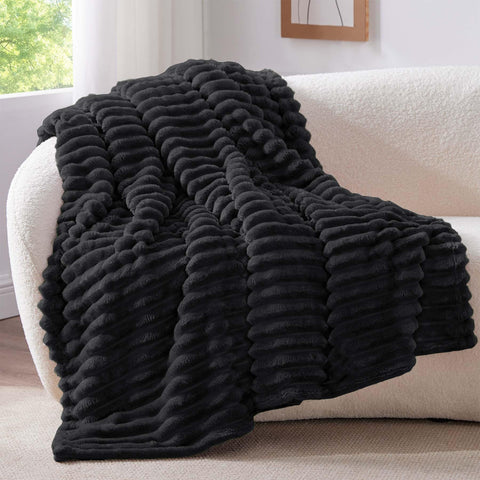BEDELITE 300GSM fleece throw highlights textured stripes for a stylish bedroom accent.
