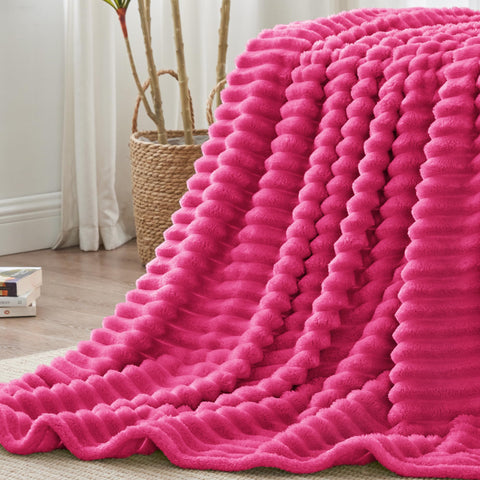 BEDELITE all-seasons blanket on bed or chair, breathable warmth.