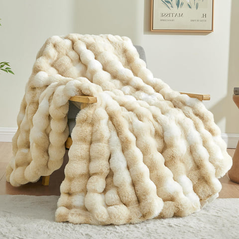 BEDELITE faux fur throw with tie-dye khaki adds cozy color to any couch.
