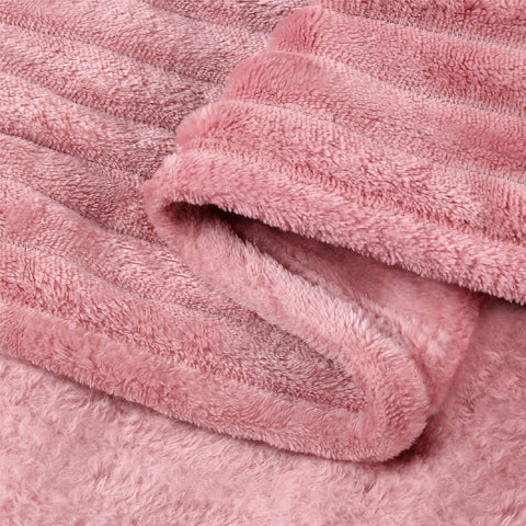 BEDELITE fleece blanket on couch with tea for a relaxed scene