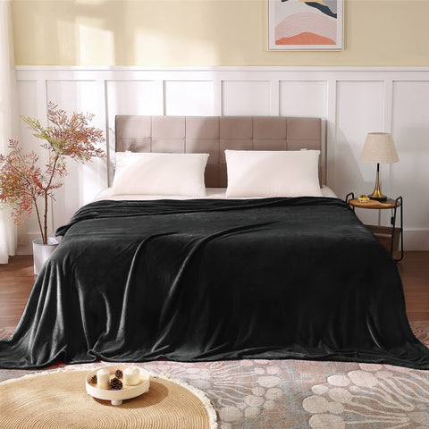 BEDELITE fleece blanket on a couch delivering cozy comfort.