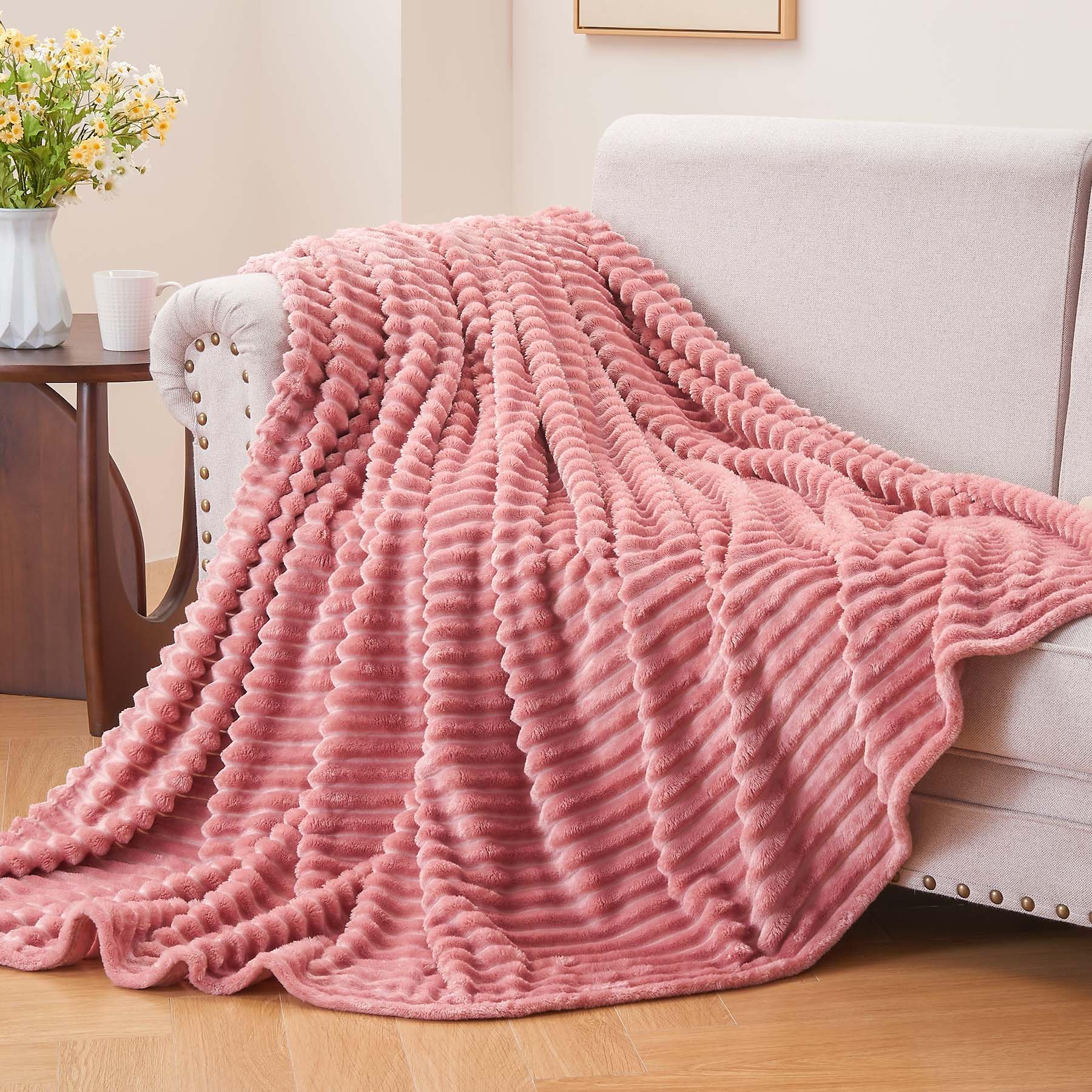 BEDELITE fleece blanket pink spread over bed adding decorative texture