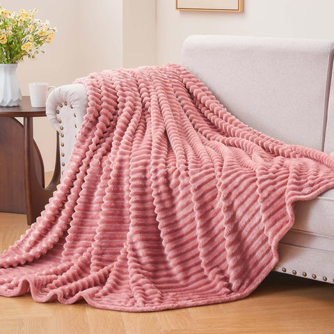 BEDELITE fleece blanket pink spread over bed adding decorative texture