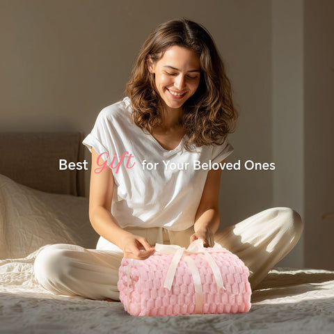 BEDELITE pink-hued fleece blanket adds decorative warmth to any room.