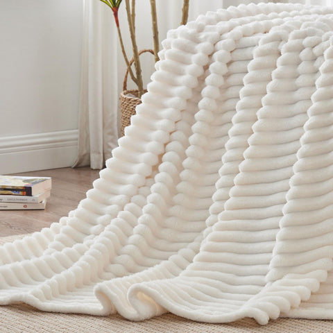 Gift-ready BEDELITE fleece blanket framed by cream stripes