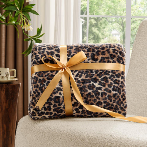 BEDELITE leopard blanket draped chair provides cozy accent during reading