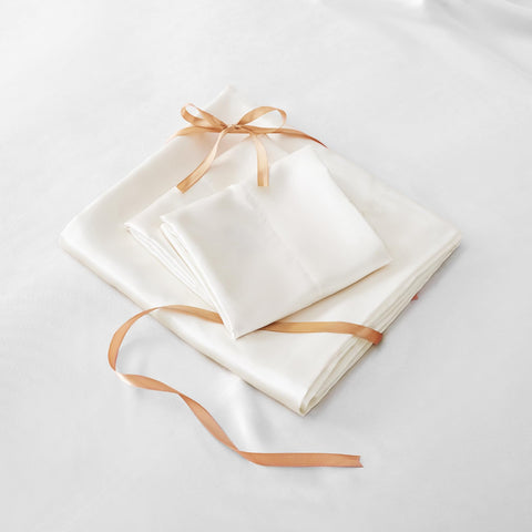 BEDELITE satin sheet set folded, showcasing compact packaging and color