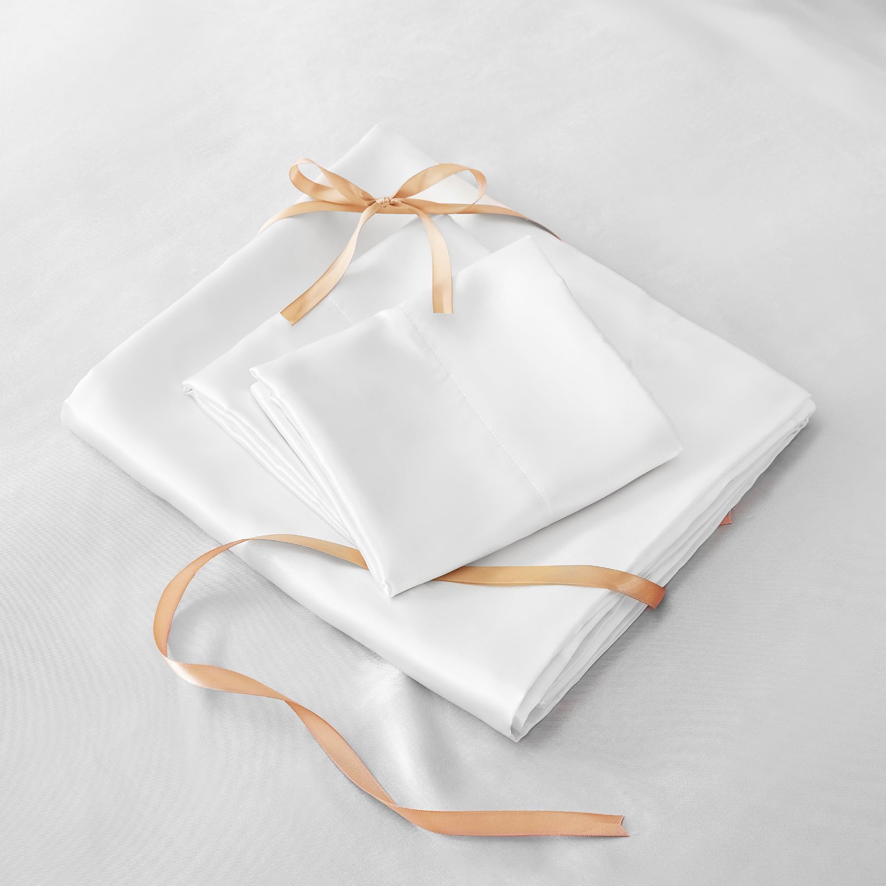 BEDELITE satin sheets easy-care instruction visuals for cold-water wash and low tumble dry