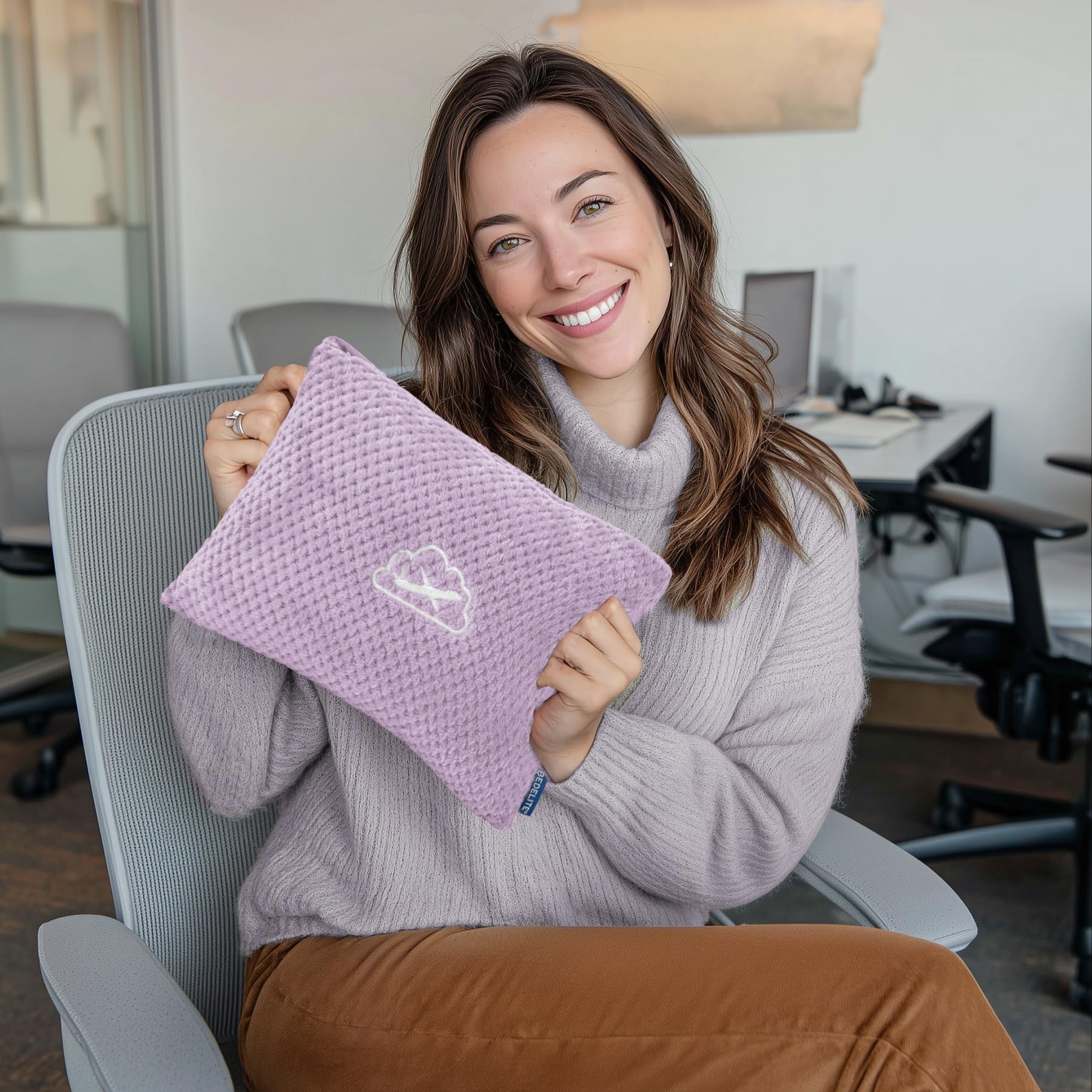 BEDELITE blanket attached to luggage sleeve on a suitcase for hands-free travel.