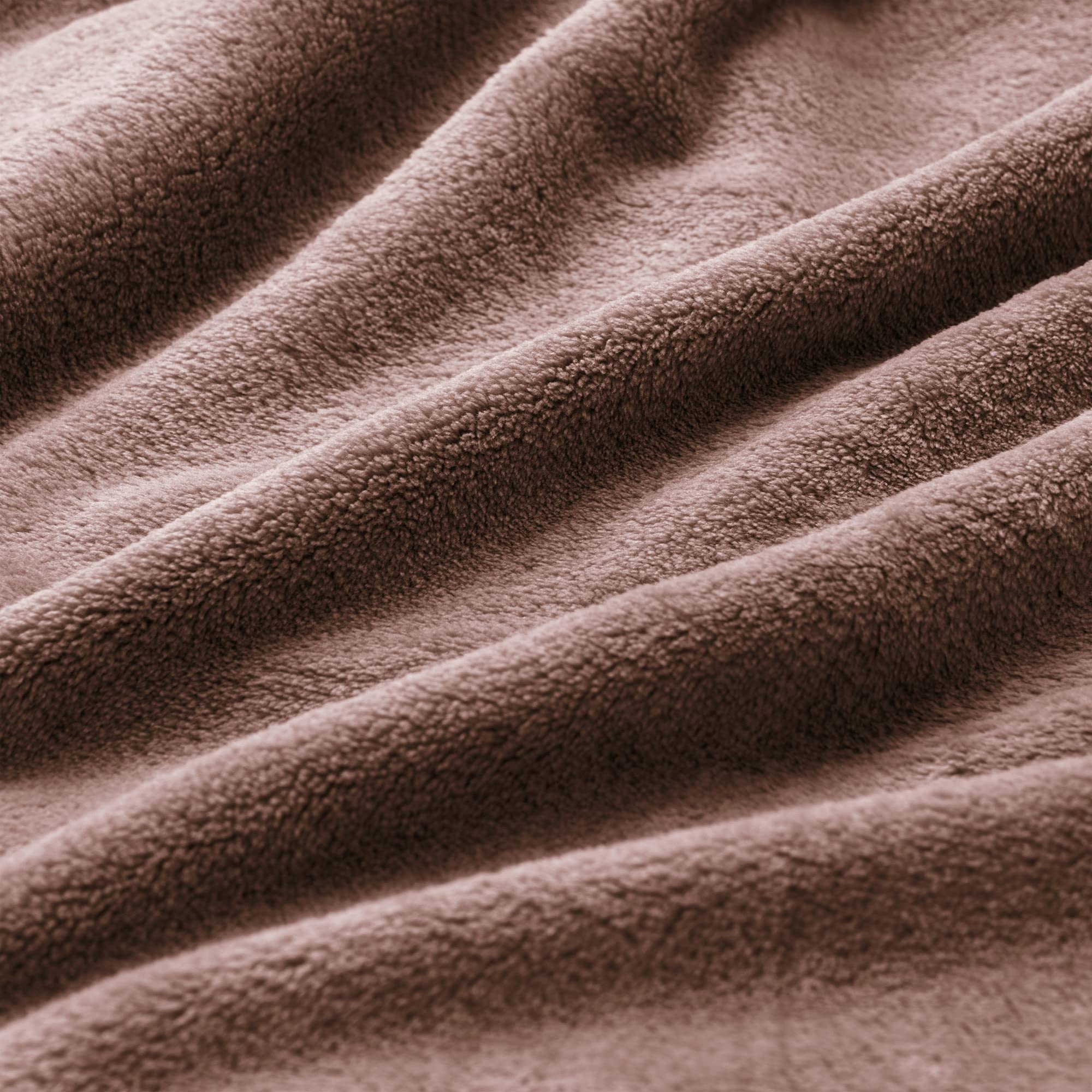 BEDELITE brown fleece blanket draped over a chair highlighting soft plush.