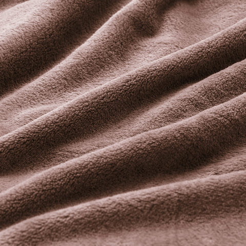 BEDELITE brown fleece blanket draped over a chair highlighting soft plush.