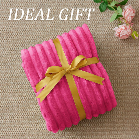 BEDELITE blanket draped on sofa for couch-time, camping, or travel.