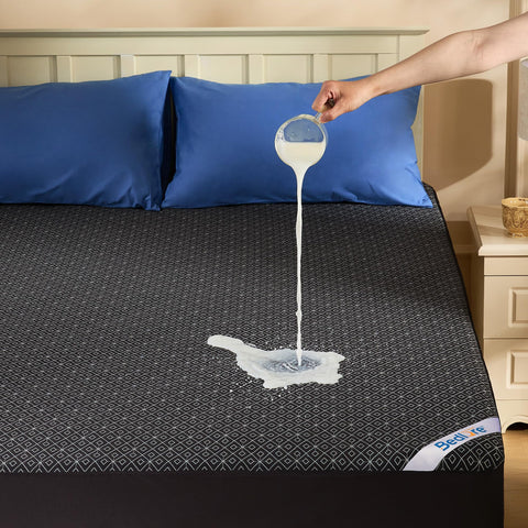 BEDLORE full-size mattress protector waterproof layer protects against spills.
