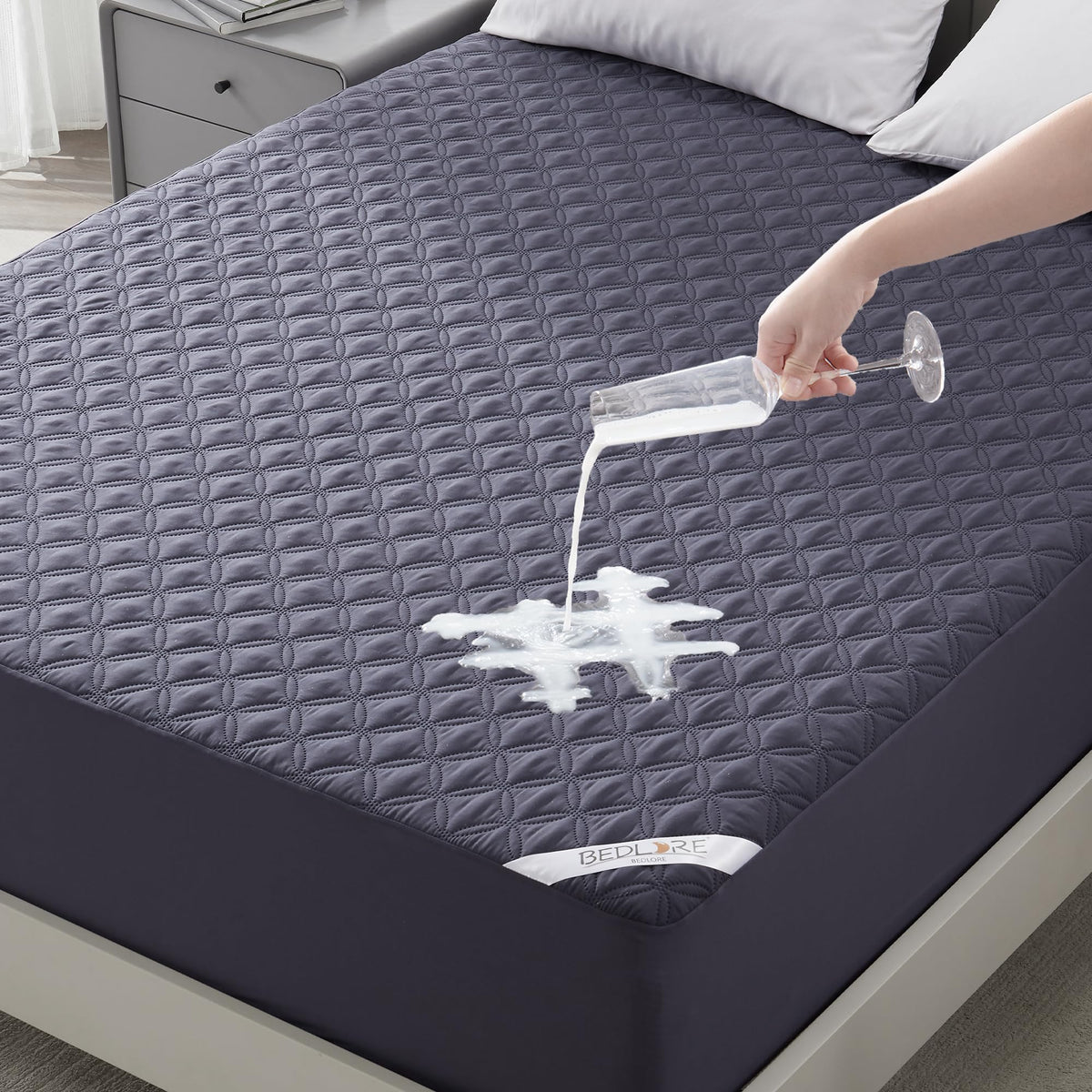 BEDLORE waterproof mattress protector with full-depth fit guards against spills and stains