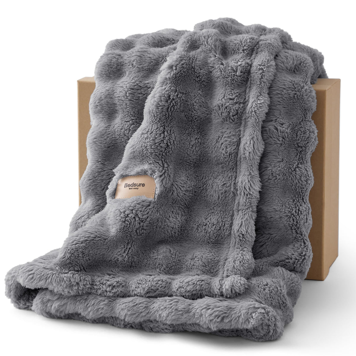 Bedsure 3D fleece bubble blanket on couch highlights cozy texture.