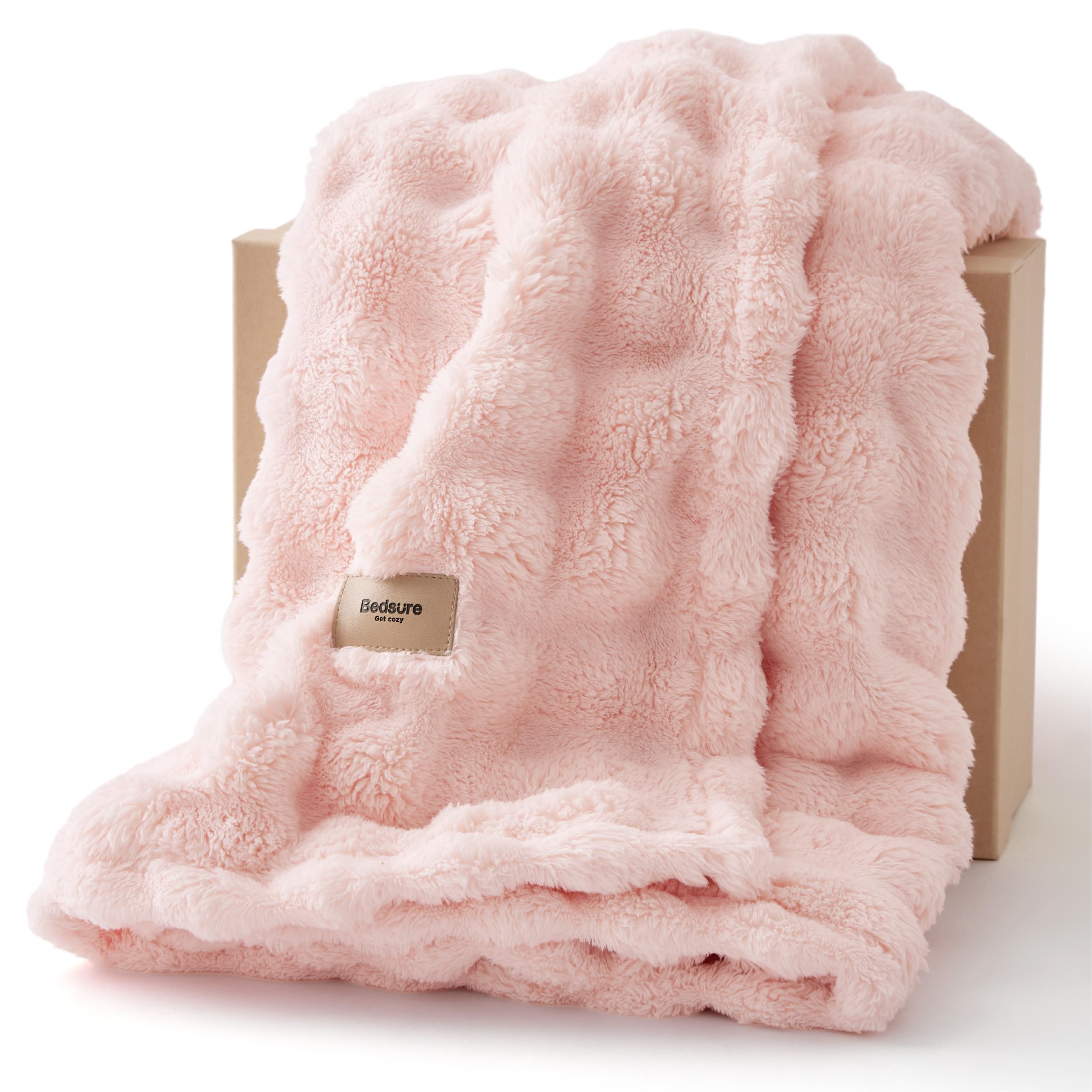 Bedsure 3D Bubble blanket on couch adds soft texture and inviting warmth.