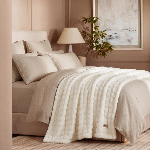 Bedsure bed-decor blanket draped at foot of bed adds color and texture.