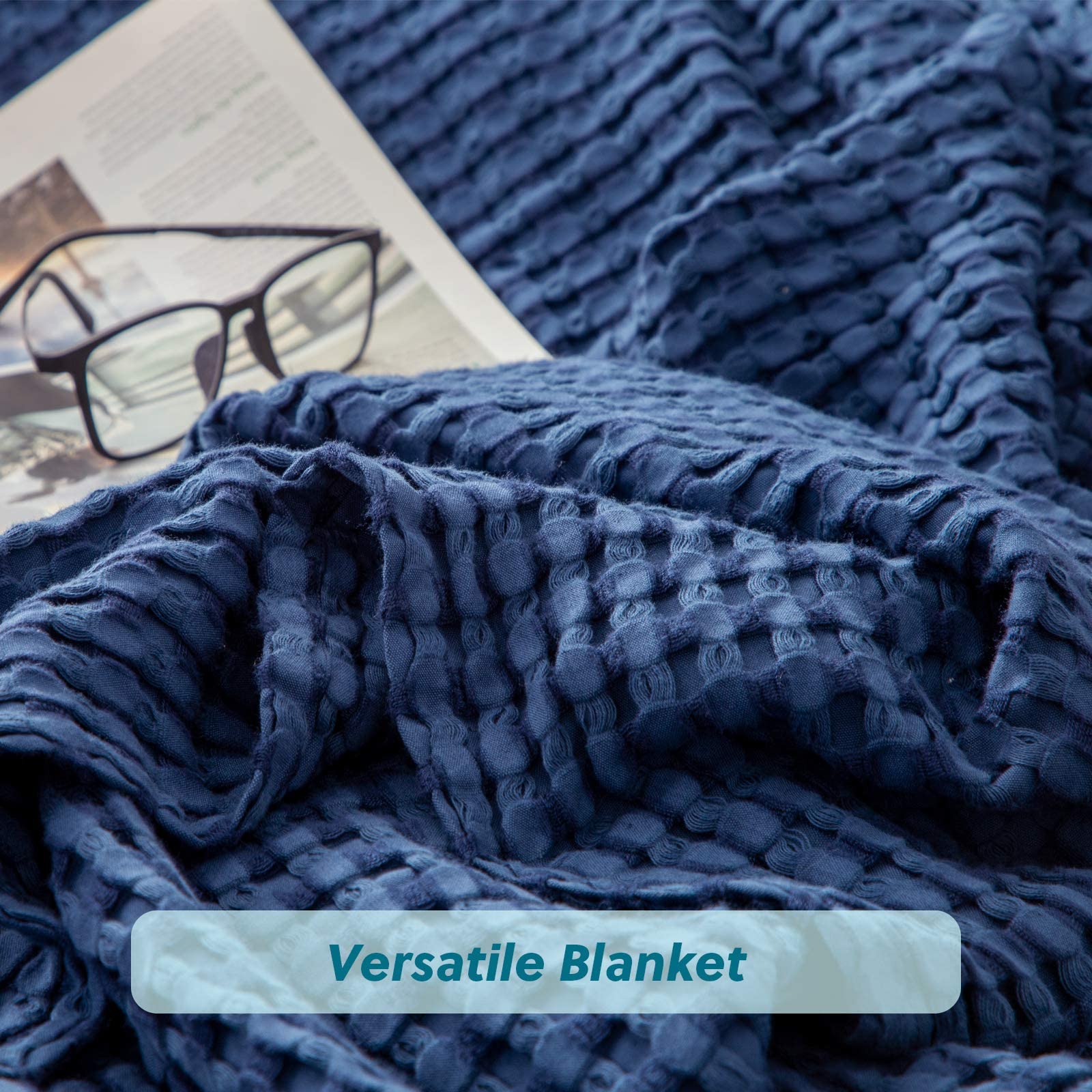 Bedsure bedroom scene with navy king blanket draped over bed.
