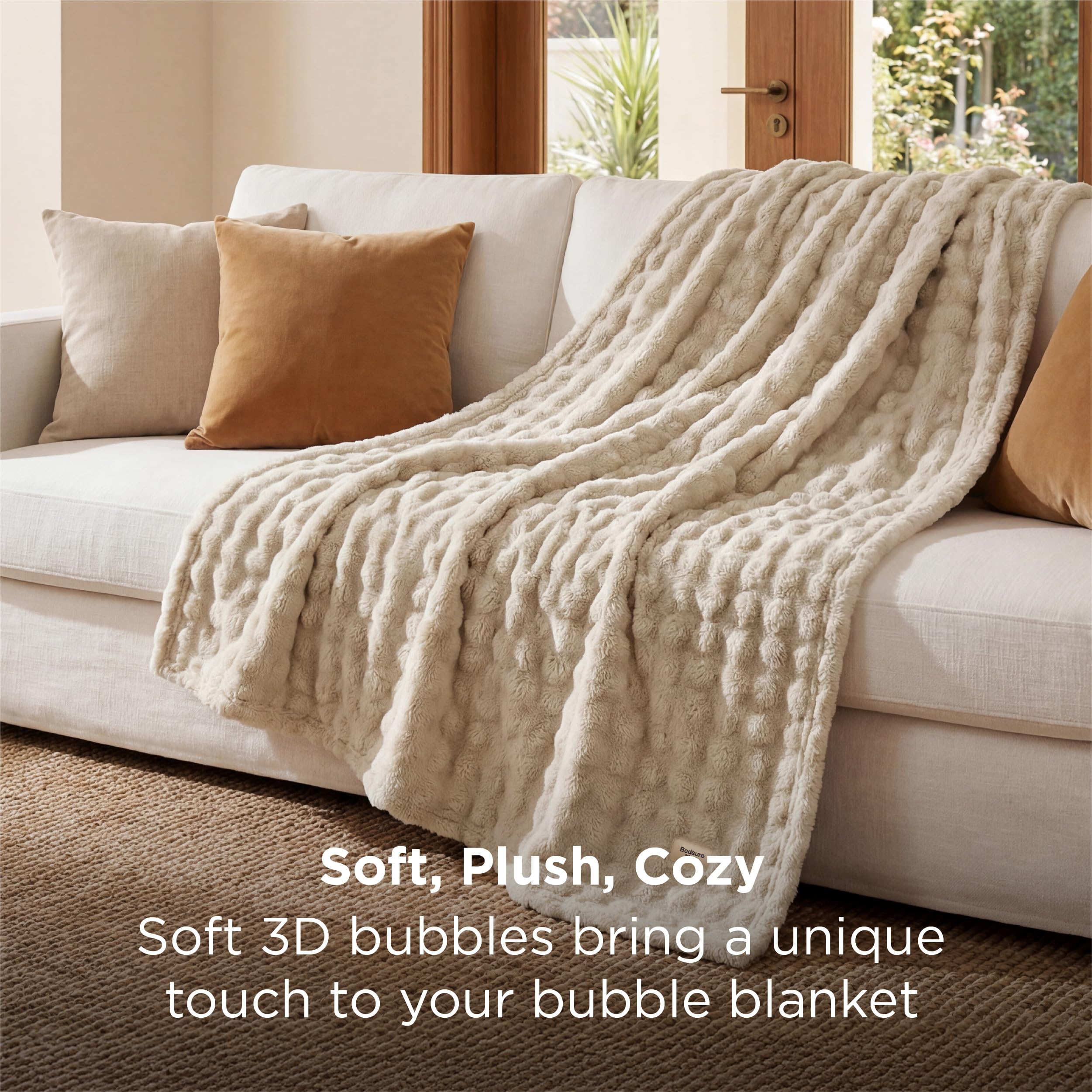 Bedsure beige cozy blanket on bed adds texture and warmth.