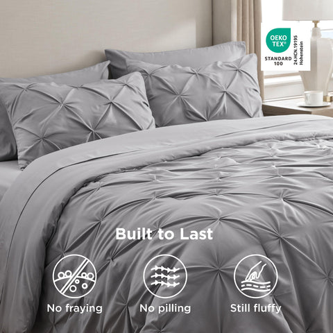 Bedsure grey comforter draped on a California King bed