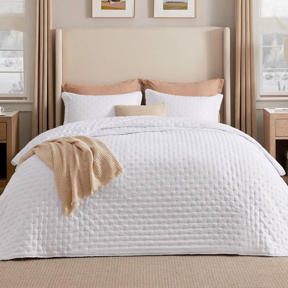Bedsure California King quilt bright white on bed, all-season comfort.