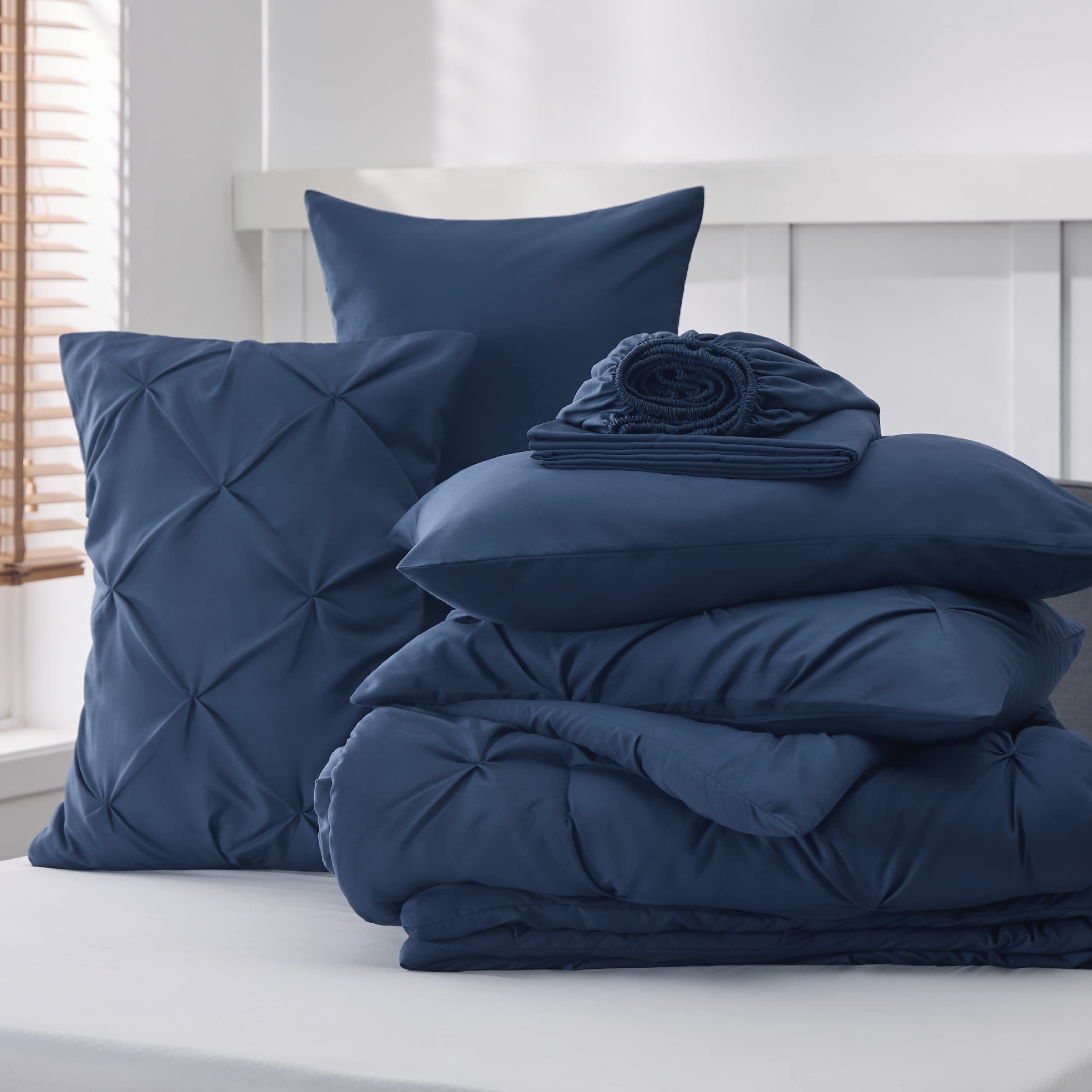 Bedsure closeup pintuck navy highlights texture and luxury feel.