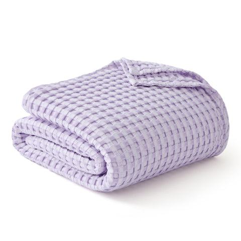 Bedsure cooling cotton waffle blanket laid on bed for inviting sleep setup
