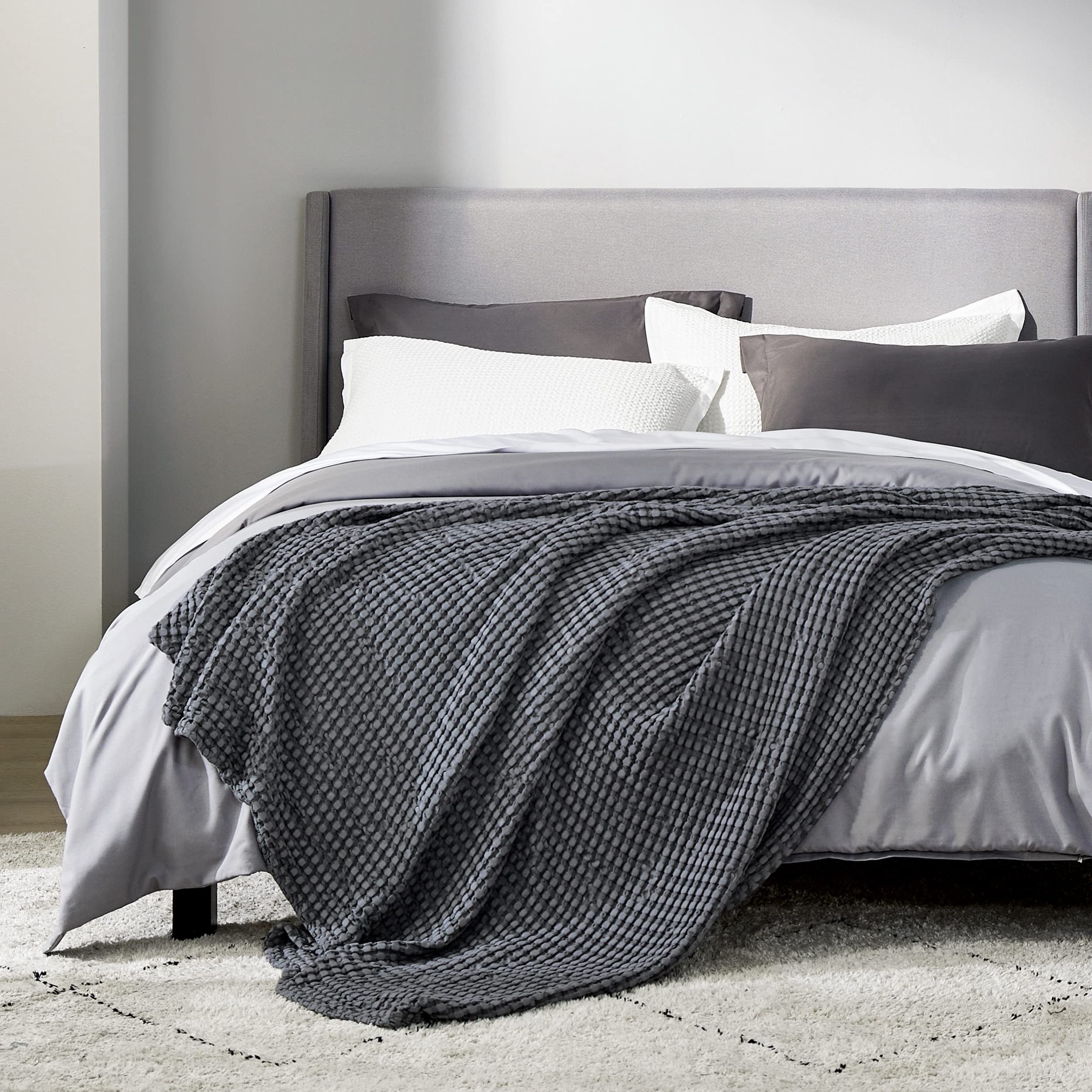 Bedsure dark grey blanket on sofa adds casual luxury