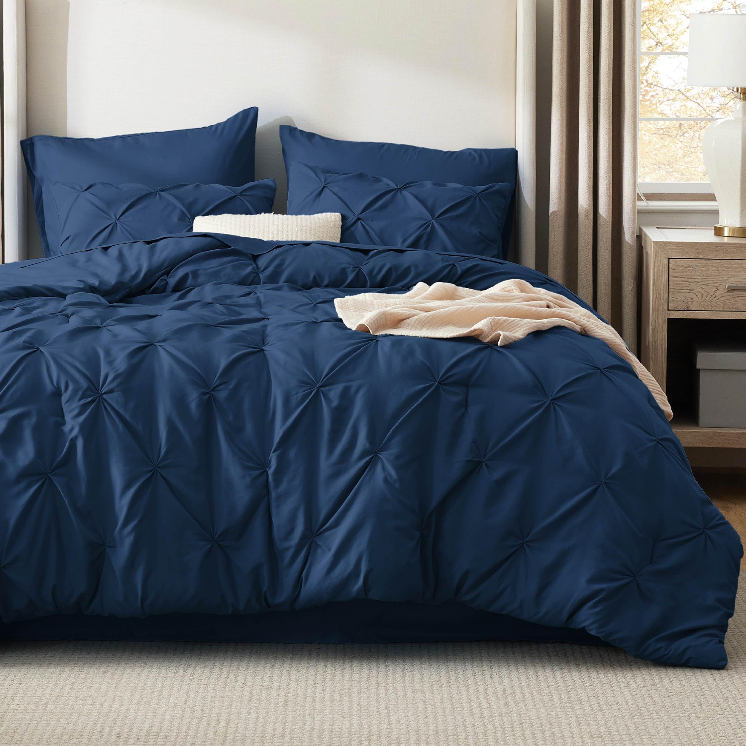 Bedsure dorm-room ready navy bedding keeps spaces neat and inviting.