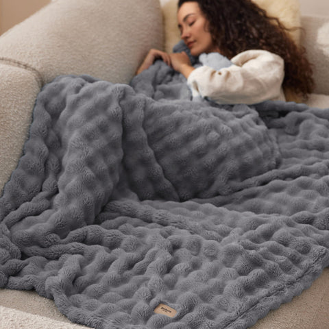 Bedsure grey plush throw styled for easy layering.