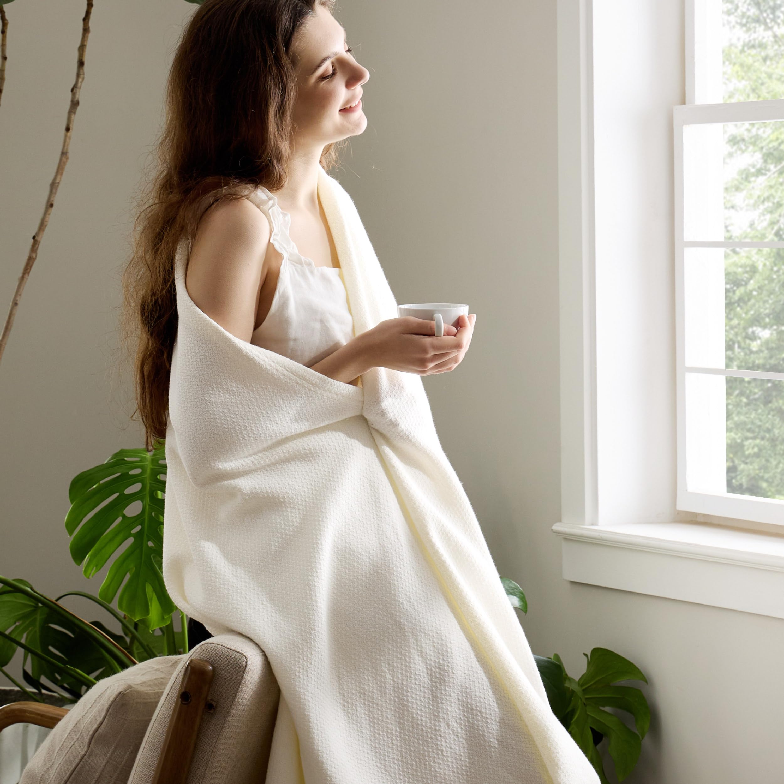 Bedsure GentleSoft cream throw on an office chair demonstrates lightweight warmth
