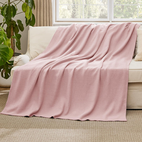Bedsure GentleSoft 66x90 blanket on a dorm bed for airy all-season warmth.