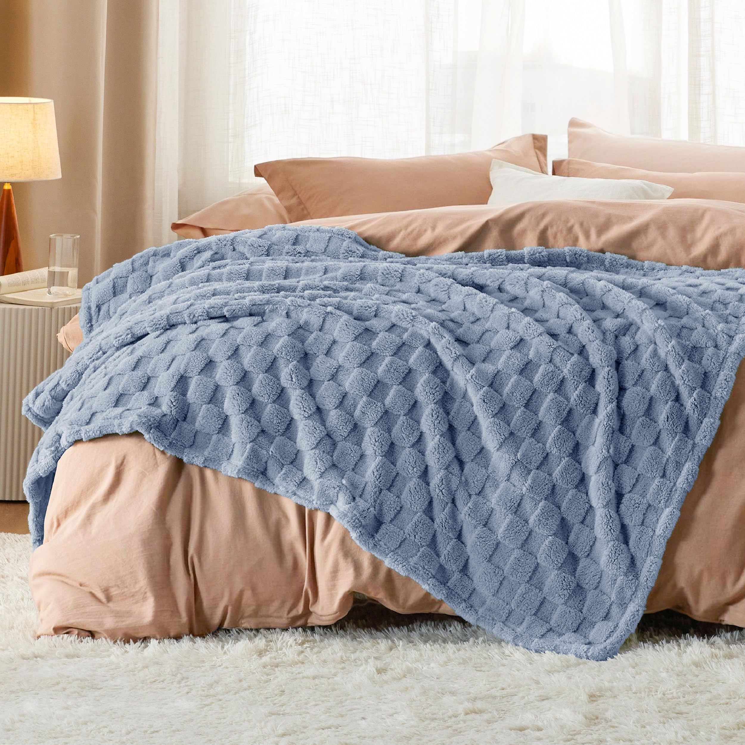 Bedsure GentleSoft Ashley Blue Throw in a dorm room, durable and machine washable for students.