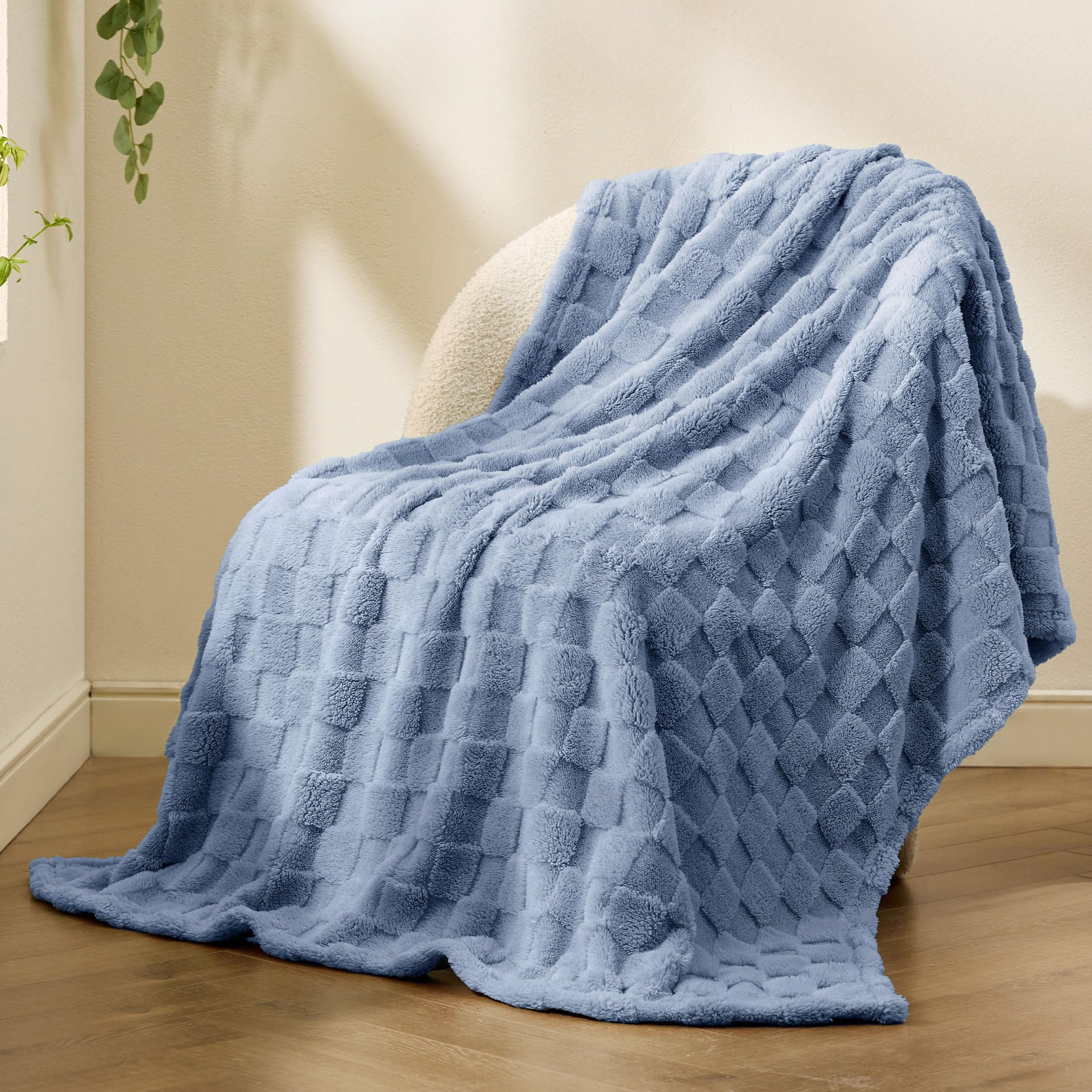 Bedsure GentleSoft Ashley Blue Throw on the sofa, everyday comfort without bulk.