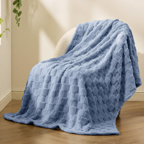 Bedsure GentleSoft Ashley Blue Throw on the sofa, everyday comfort without bulk.