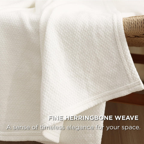 Bedsure GentleSoft blanket draped over a sofa for breathable comfort on summer nights.