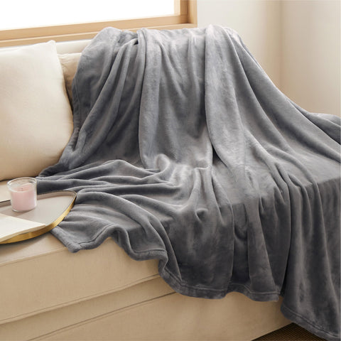 Bedsure GentleSoft blanket folded on a bed in grey for lightweight warmth