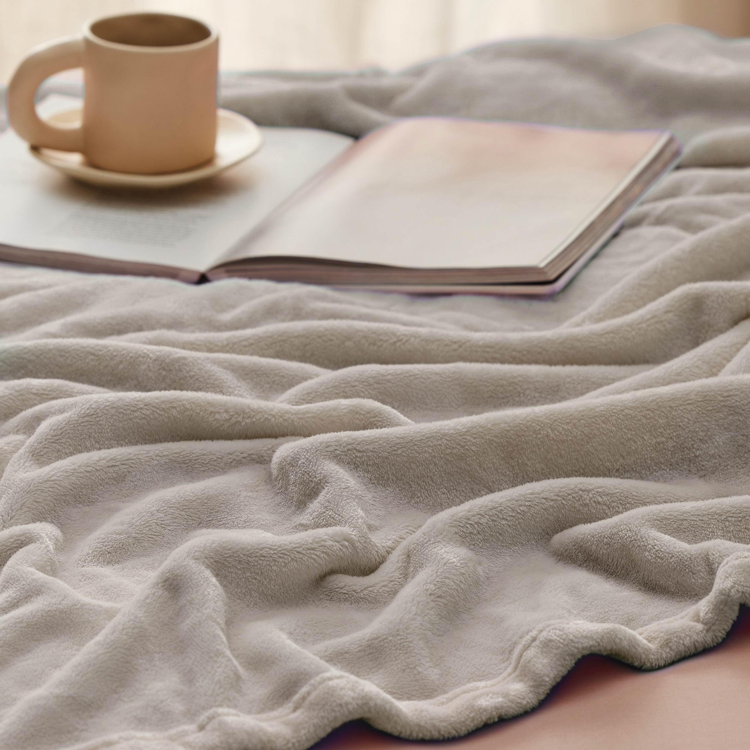 Bedsure GentleSoft blanket draped as a lightweight throw for a couch.