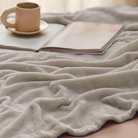 Bedsure GentleSoft blanket draped as a lightweight throw for a couch.