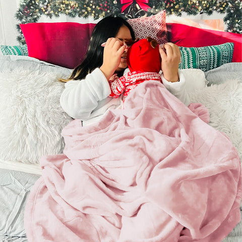 Bedsure GentleSoft pink blanket on sofa as a cozy couch companion.