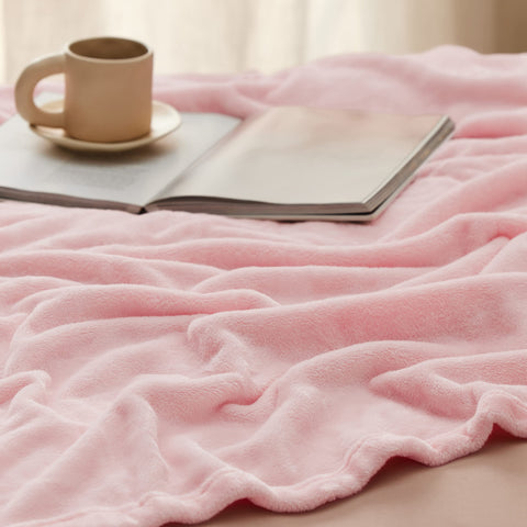 Bedsure GentleSoft pink blanket ready for travel with lightweight warmth.
