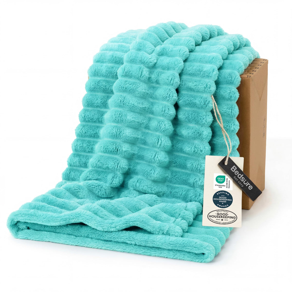 Bedsure GentleSoft Blue Fog blanket on couch for cozy evenings.