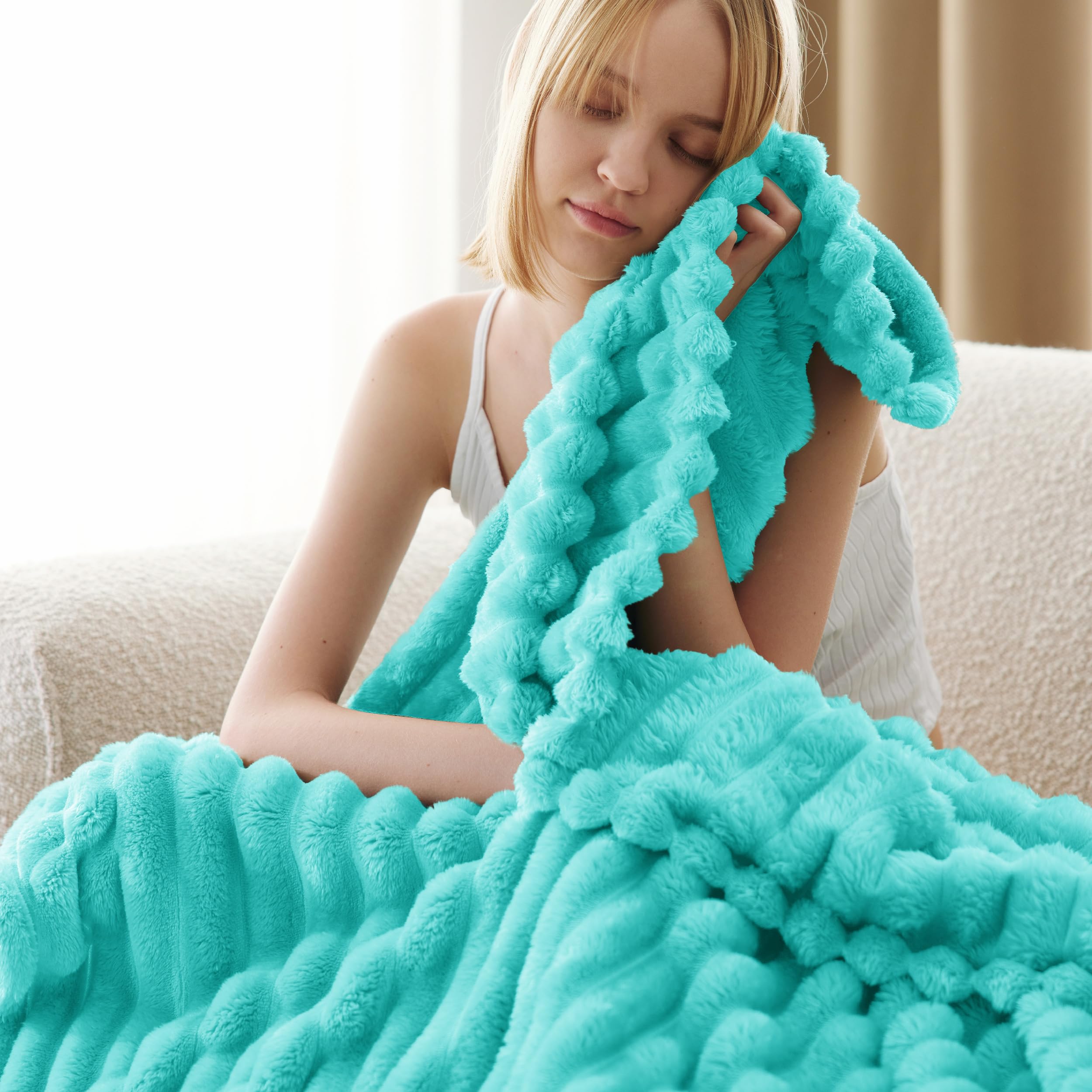 Bedsure GentleSoft Blue Fog throw draped over bed.