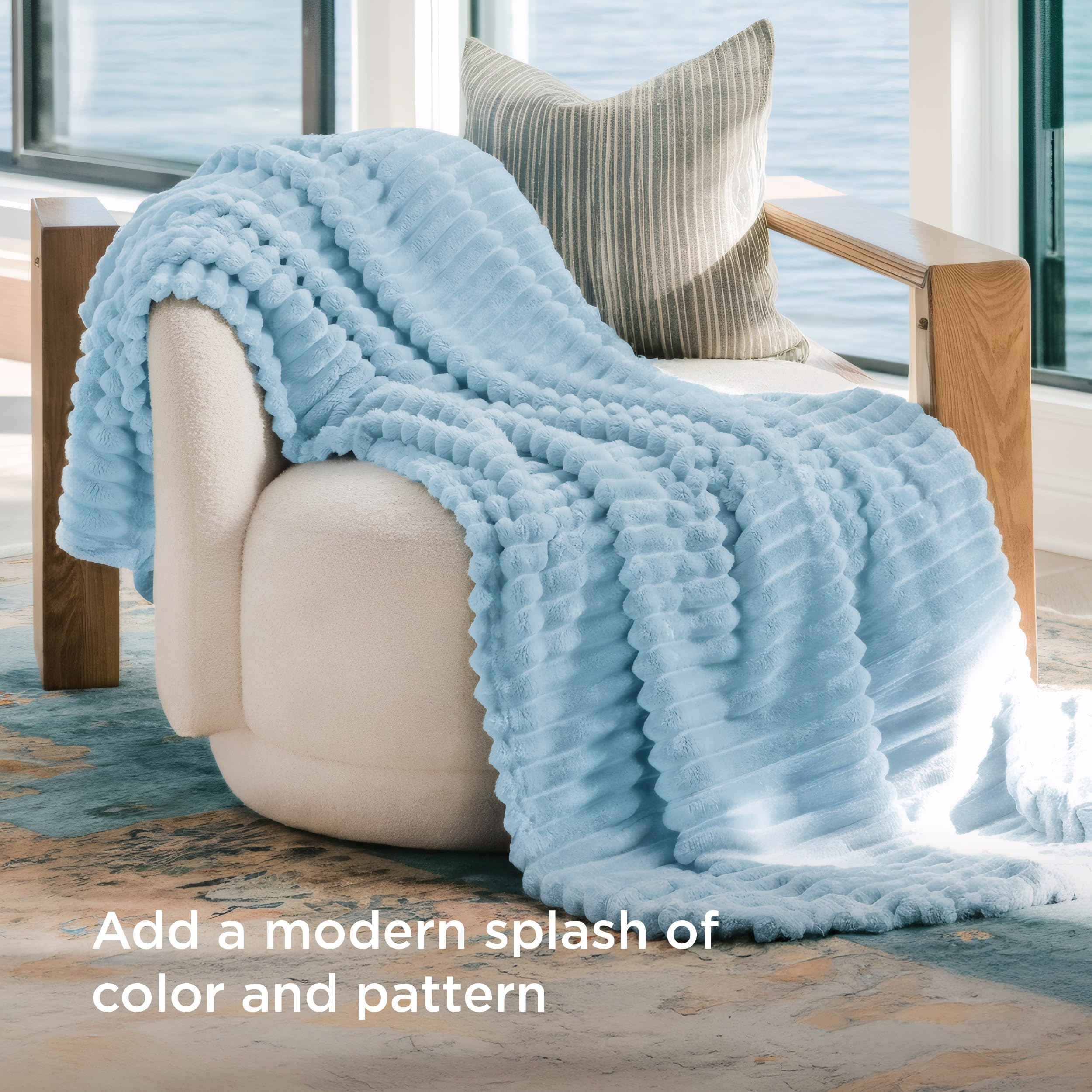 Bedsure GentleSoft blue throw stripe pattern complements modern living room design.