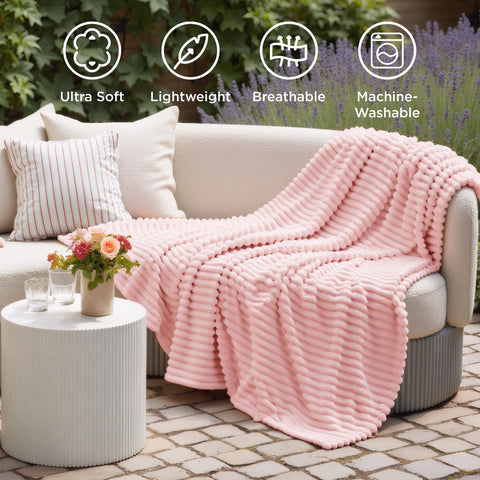 Neat stitching on Bedsure GentleSoft coral pink blanket shows durability