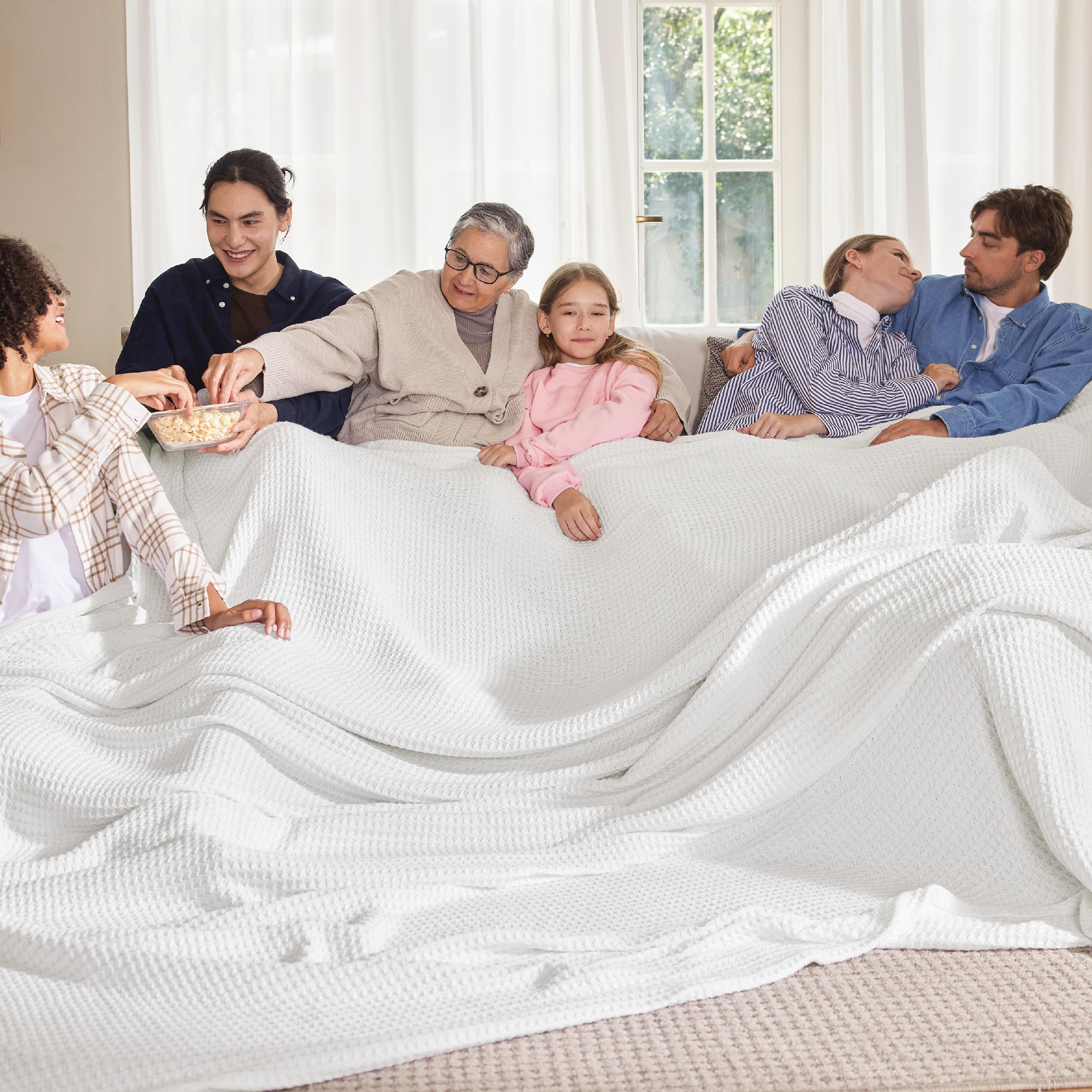 Bedsure Gentlesoft cotton blanket on white bed for year‑round comfort