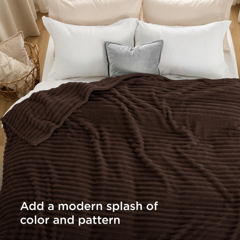 Bedsure GentleSoft blanket folded to accent bedroom decor.
