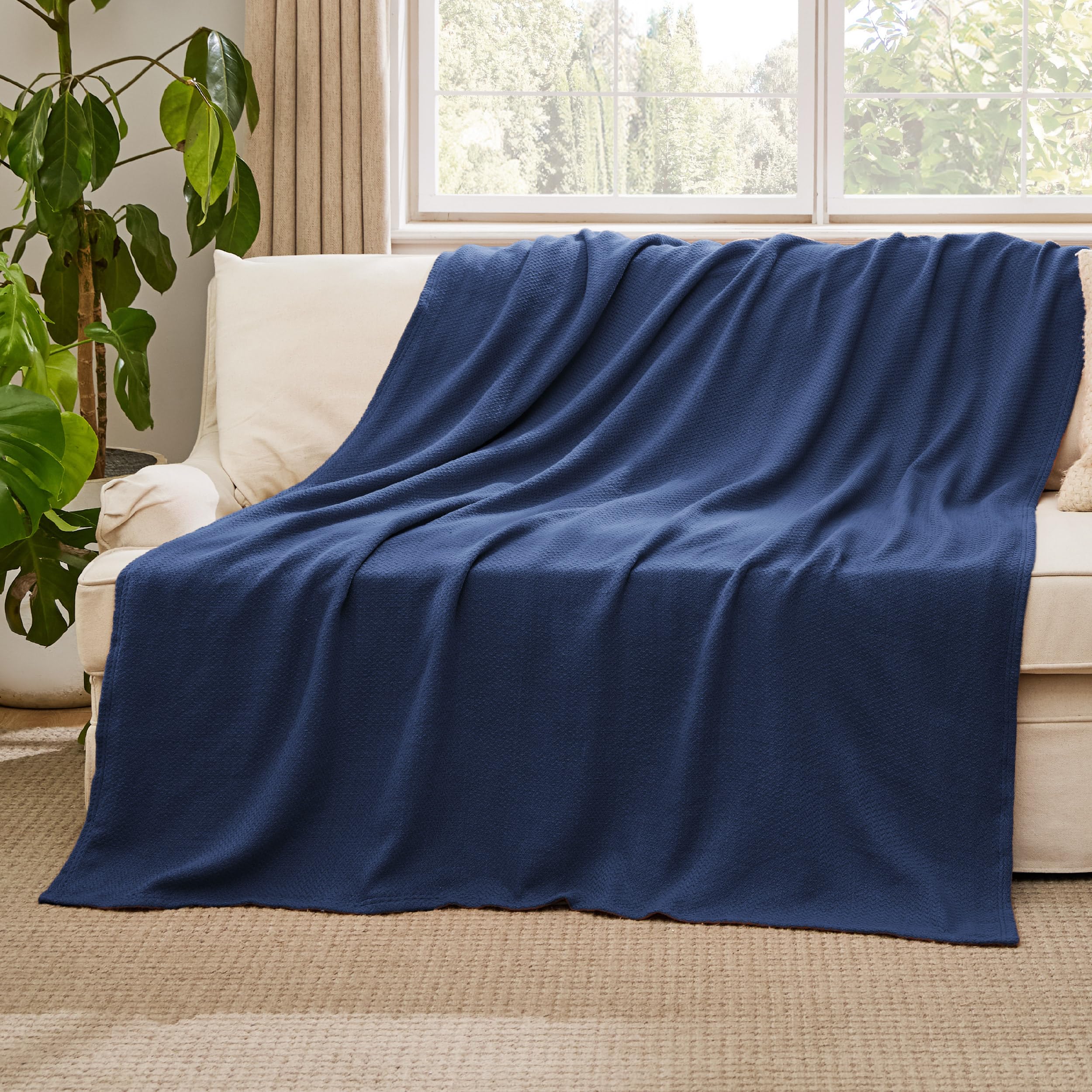 Dorm room scene with Bedsure blanket folded neatly for storage.