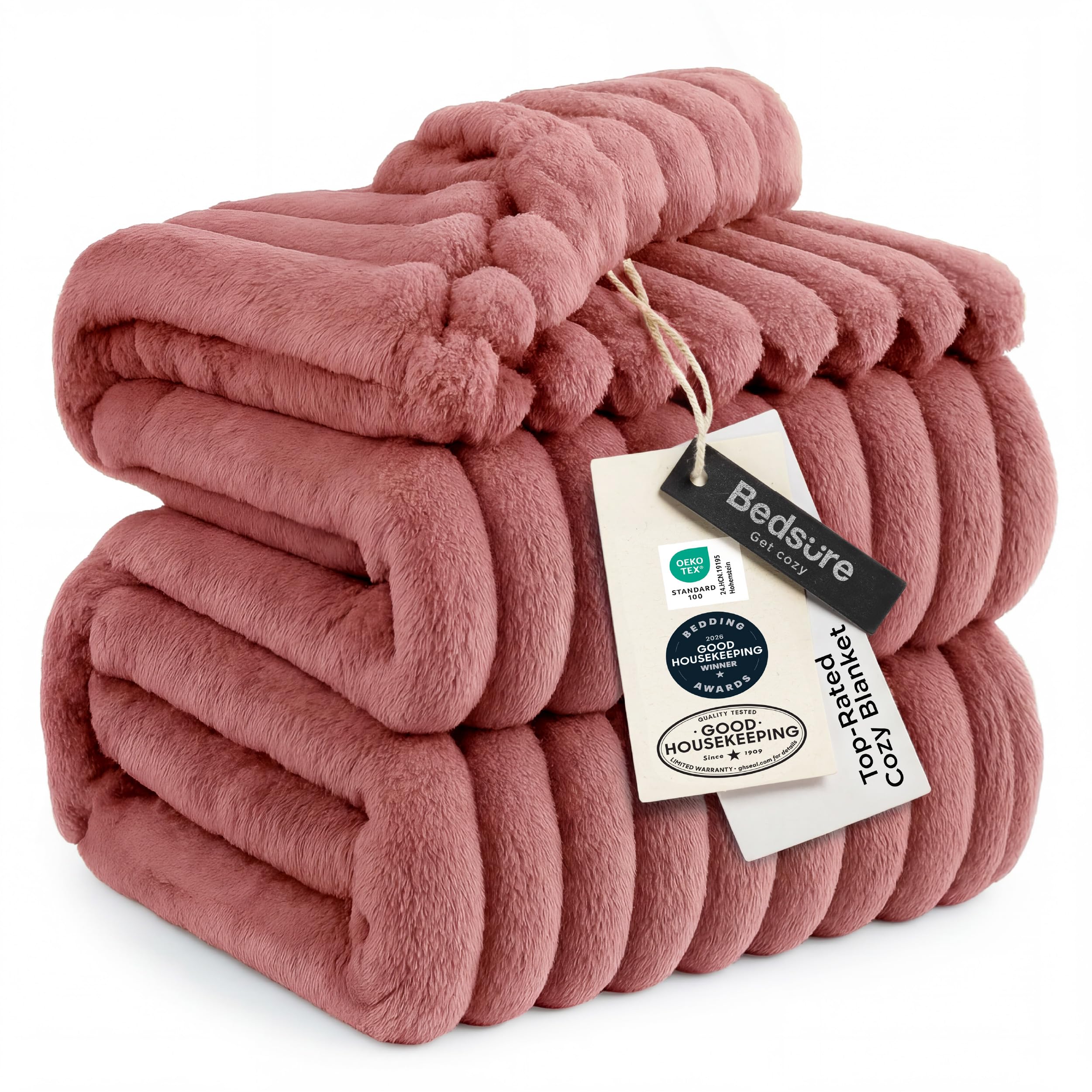 Bedsure GentleSoft dusty pink fleece blanket close-up highlighting ultra soft plush texture for cozy evenings.