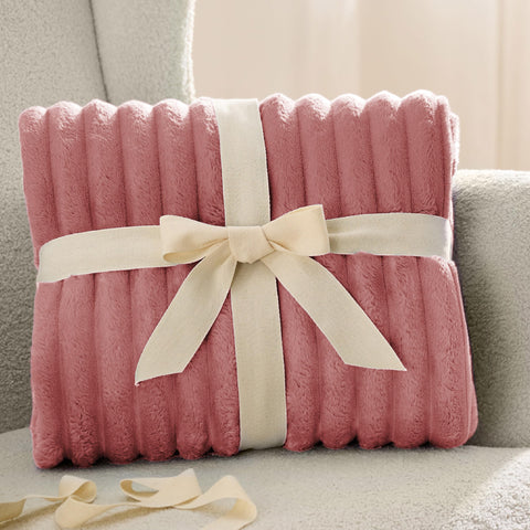 Bedsure GentleSoft dusty pink fleece blanket ideal for girls rooms and women's lounges.